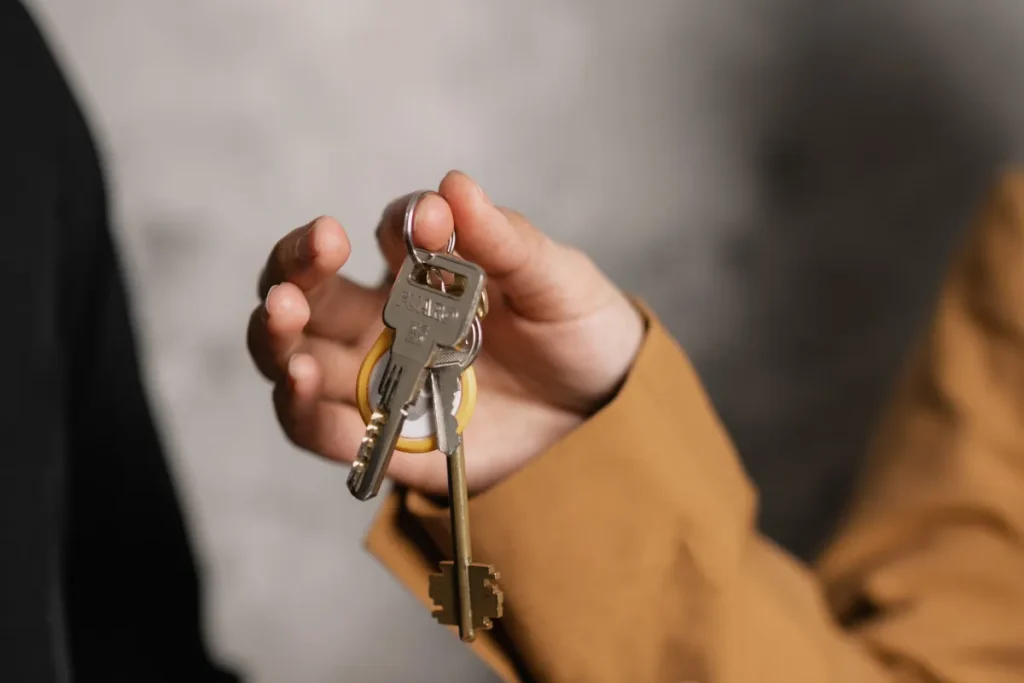 Hand holding a set of house keys